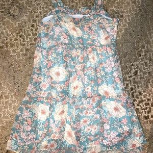 Boutique dress. Sheer Floral design with adjustable tie shoulder straps. NWOT.
